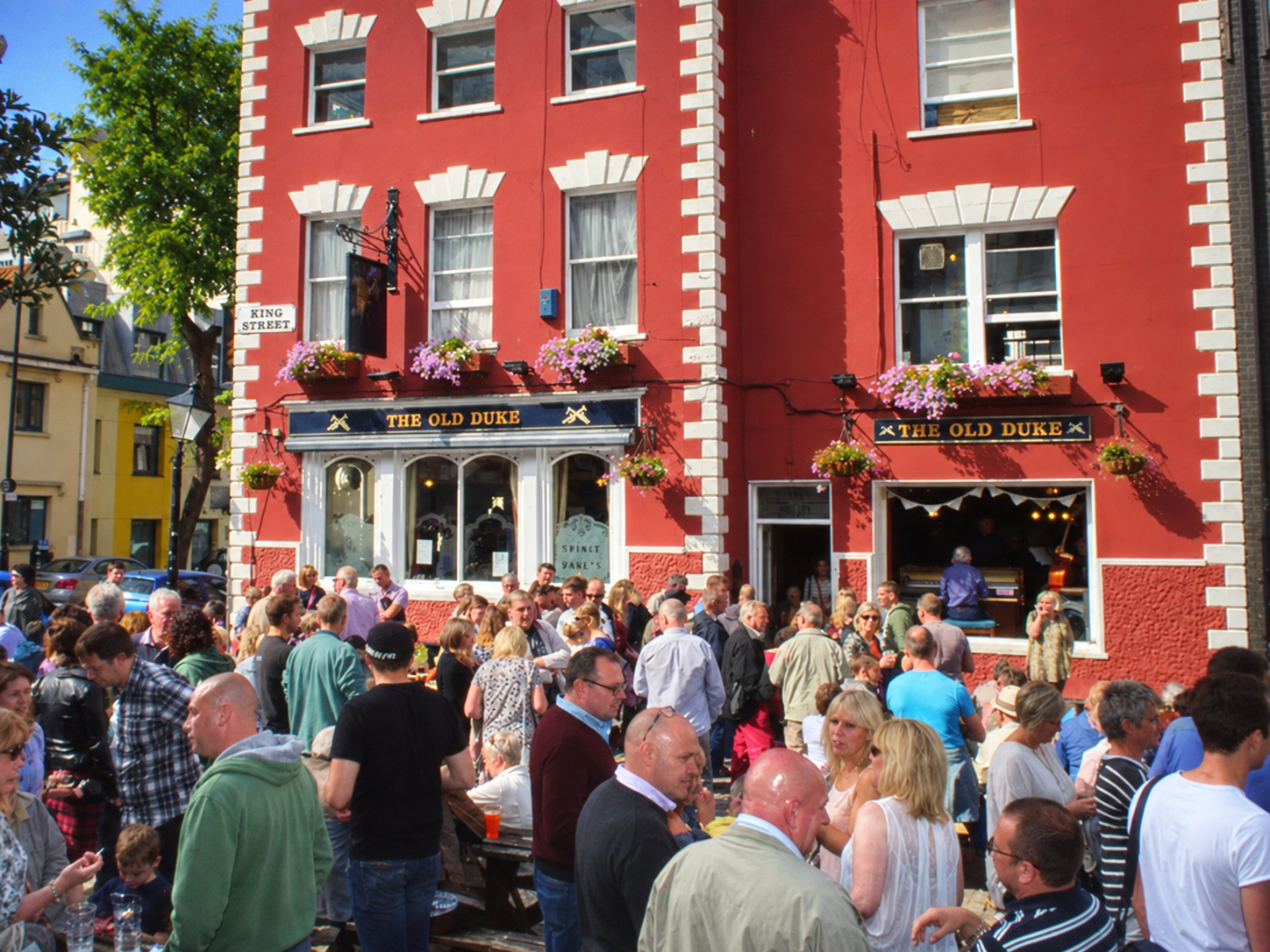 A crowd outside The Old Duke on King Street in Bristol